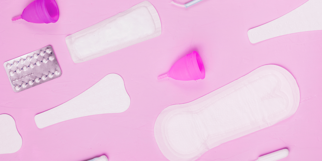 pink background period products menstrual cup and pads